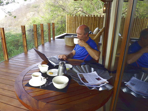 The author working on a laptop virtually while drinking coffe in Nicaragua.