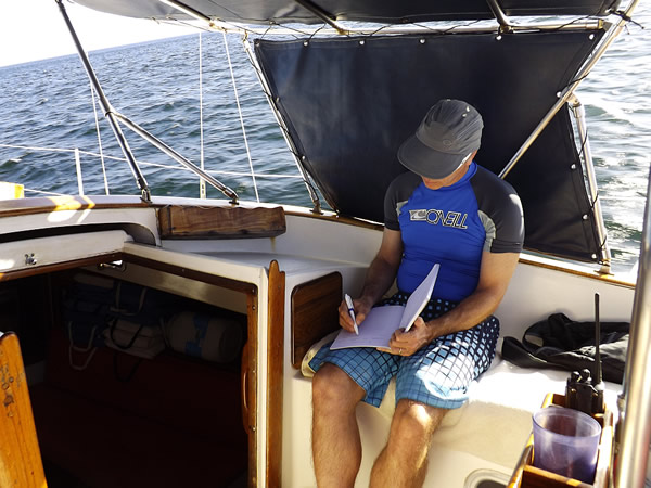 The author, a digital nomad, working on a boat