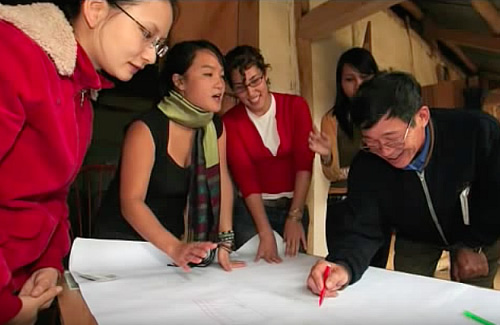 Vi Hoang at work with community leaders in Northern Vietnam