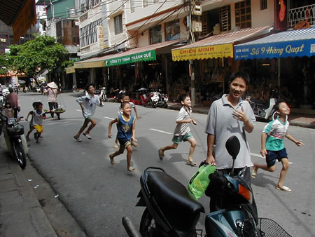 Kids running in Hanoi