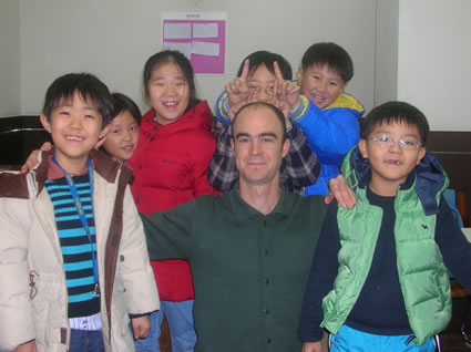 Teacher with young students.