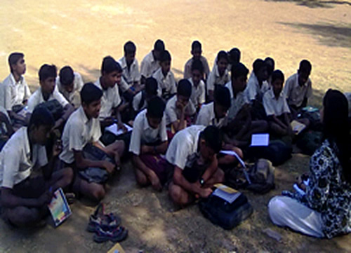 Teaching boys in India