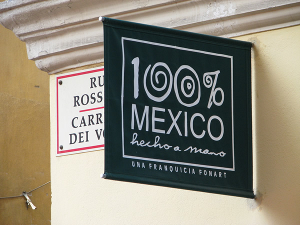 A shop sign in Nice, France is one way to wake up to  work abroad.