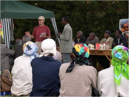 Volunteer training dairy producers in Kenya