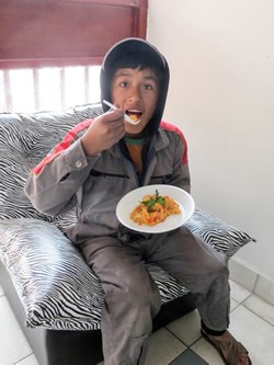 Bolivian child eating lunch