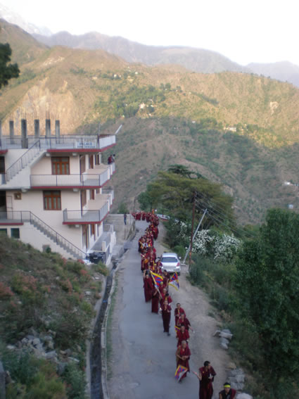 Monks pass by the school