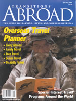 Transitions Abroad magazine cover of old Indian Man reading book.
