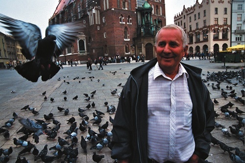 Man with pigeons in Krakow