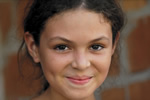 A young girl smiling in Ecuador.