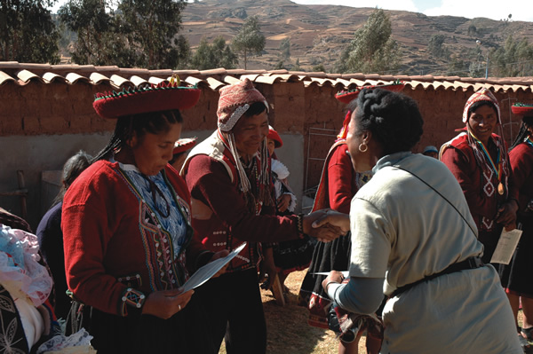 Peruvian weavers proudly display winning entries.