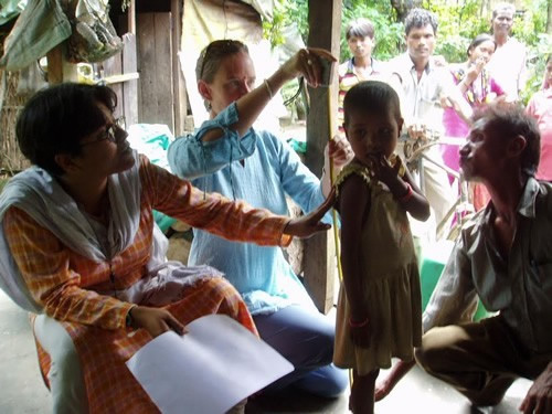 Volunteer Sutay Berman treats a child.