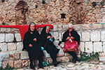 Elder women sitting in Sicily.