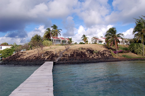 View of bridge to houses across water in the Martinique.