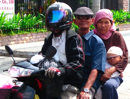 Family on a scooter in Cambodia.