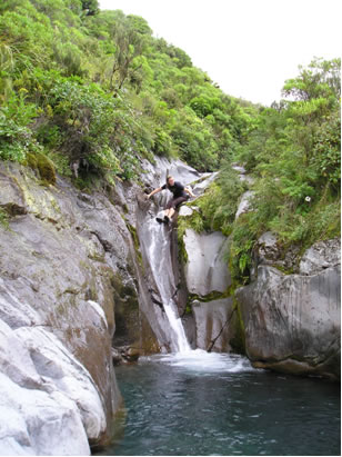 Jumping off a waterfall in New Zealand