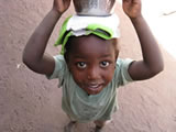 Girl with milk in Gambia